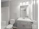 Bathroom featuring a gray vanity, mirror, toilet, and a shower-tub combo at 106 Desert Sky Ct, Statesville, NC 28625