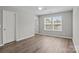 Bedroom with two doors and a double window allowing plentiful light at 106 Desert Sky Ct, Statesville, NC 28625