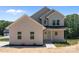 Charming two-story home with a covered front porch and modern siding at 106 Desert Sky Ct, Statesville, NC 28625