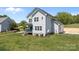 Two-story home with gray siding on a large lot with an attached garage at 106 Desert Sky Ct, Statesville, NC 28625