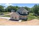 Two-story home features an attached garage and well-manicured landscaping at 106 Desert Sky Ct, Statesville, NC 28625