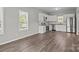 Modern kitchen with white cabinets, stainless steel appliances, granite counters, and wood-look flooring at 106 Desert Sky Ct, Statesville, NC 28625