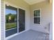 Covered patio with sliding glass doors leading to the backyard at 106 Desert Sky Ct, Statesville, NC 28625