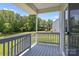 Covered porch overlooking a green backyard at 106 Desert Sky Ct, Statesville, NC 28625