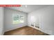 Bright bedroom features a window with natural light and french doors at 11135 Cardinal Creek Ave, Charlotte, NC 28215