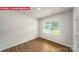 This bedroom features beautiful wood floors and a window providing natural light at 11135 Cardinal Creek Ave, Charlotte, NC 28215