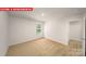 Bright bedroom with neutral carpet, natural light, and closet at 11135 Cardinal Creek Ave, Charlotte, NC 28215