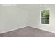 Bright bedroom with a window showcases a calming and inviting atmosphere at 11135 Cardinal Creek Ave, Charlotte, NC 28215