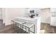 Modern kitchen featuring stainless steel appliances and a spacious island with seating at 11135 Cardinal Creek Ave, Charlotte, NC 28215