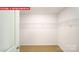 Spacious walk-in closet featuring shelving and carpeted flooring to help organize your wardrobe at 11135 Cardinal Creek Ave, Charlotte, NC 28215