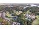 An aerial view of a golf course community surrounded by lakes and fall foliage with many community amenities at 1119 Palmyra Dr, Tega Cay, SC 29708