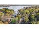 Majestic aerial view of lakefront property with mature trees and blue water at 1119 Palmyra Dr, Tega Cay, SC 29708