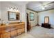 Vanity in the bathroom with a window, mirror, and access to bedroom at 1119 Palmyra Dr, Tega Cay, SC 29708