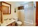 A well-maintained bathroom with a white vanity, toilet, and shower/tub combination at 1119 Palmyra Dr, Tega Cay, SC 29708