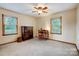 A spacious bedroom with neutral walls, carpet, and natural light from two windows at 1119 Palmyra Dr, Tega Cay, SC 29708