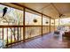Spacious covered deck with ceiling fan and scenic views of the surrounding nature at 1119 Palmyra Dr, Tega Cay, SC 29708