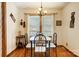 A charming dining area with wood floors and a window providing natural light at 1119 Palmyra Dr, Tega Cay, SC 29708