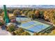 An aerial view of tennis courts surrounded by fall foliage shows active recreation and a community amenity at 1119 Palmyra Dr, Tega Cay, SC 29708