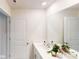 Modern bathroom showcasing sleek white vanity, large mirror, and contemporary fixtures at 11216 Cardinal Creek Ave, Charlotte, NC 28215