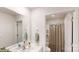 Bright bathroom featuring a shower with curtain, white cabinets, and neutral tones at 11216 Cardinal Creek Ave, Charlotte, NC 28215