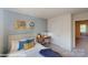 Comfortable bedroom with a desk, gray and blue color scheme, and a nice window view at 11216 Cardinal Creek Ave, Charlotte, NC 28215
