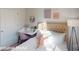 Bright bedroom featuring a desk, comfortable bed with decorative pillows, and stylish decor at 11216 Cardinal Creek Ave, Charlotte, NC 28215