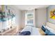 Inviting bedroom featuring colorful modern decor, a large window, and soft bedding at 11216 Cardinal Creek Ave, Charlotte, NC 28215