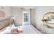 Inviting bedroom with a bed, dresser, and large window with a scenic view at 11216 Cardinal Creek Ave, Charlotte, NC 28215