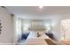 Relaxing bedroom features a plush bed, soft lighting, and ensuite bathroom access, creating a serene and private retreat at 11216 Cardinal Creek Ave, Charlotte, NC 28215