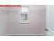 Walk-in closet with wire shelving and a window providing natural light at 11216 Cardinal Creek Ave, Charlotte, NC 28215
