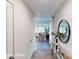 Inviting entryway with wood floors and a decorative mirror, leading to the living room at 11216 Cardinal Creek Ave, Charlotte, NC 28215