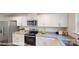 Modern kitchen showcasing white cabinetry, stainless steel appliances, and granite counters at 11216 Cardinal Creek Ave, Charlotte, NC 28215