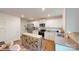 Bright kitchen featuring white cabinets, stainless steel appliances, and a center island at 11216 Cardinal Creek Ave, Charlotte, NC 28215