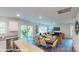 Open floorplan with a dining area flowing into a cozy living room and sliding door at 11216 Cardinal Creek Ave, Charlotte, NC 28215