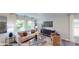 Open living room featuring a neutral palette, stylish furniture, and a large window showcasing natural light and pleasant views at 11216 Cardinal Creek Ave, Charlotte, NC 28215