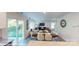 Open floorplan with a dining area flowing into a cozy living room and sliding door at 11216 Cardinal Creek Ave, Charlotte, NC 28215