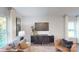 Elegant living room featuring stylish furniture, modern decor, and ample natural light, creating a comfortable and sophisticated ambiance at 11216 Cardinal Creek Ave, Charlotte, NC 28215