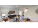 Comfortable living room with modern decor, featuring a large TV, stylish seating, and an inviting, open layout at 11216 Cardinal Creek Ave, Charlotte, NC 28215