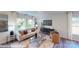 Comfortable living room featuring a neutral palette, stylish furniture, and a large window showcasing natural light and pleasant views at 11216 Cardinal Creek Ave, Charlotte, NC 28215