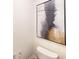 Stylish powder room with a white toilet and a framed painting adding a touch of sophistication at 11216 Cardinal Creek Ave, Charlotte, NC 28215