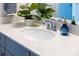 Bathroom sink with white countertop, chrome faucet, decorative plant and soap dispenser at 120 Keats Aly, Cramerton, NC 28032