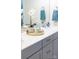 Bathroom sink with white countertop, chrome faucet, decorative plant, and a mirror at 120 Keats Aly, Cramerton, NC 28032