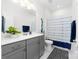 Bright bathroom with gray vanity, white countertop, and blue accents at 120 Keats Aly, Cramerton, NC 28032