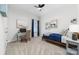 Well-lit bedroom with a desk, paintings and a comfortable single bed at 120 Keats Aly, Cramerton, NC 28032