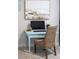 Small desk with a computer, a chair, and artwork hanging on the wall at 120 Keats Aly, Cramerton, NC 28032