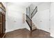 Well-lit foyer with hardwood floors, staircase, and stylish decor, creating a welcoming entrance at 120 Keats Aly, Cramerton, NC 28032