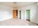 Bright bedroom featuring neutral carpet, white walls and ample closet space at 1400 Russell Ave, Charlotte, NC 28216