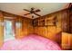 Cozy bedroom featuring wood paneling and storage shelves at 1400 Russell Ave, Charlotte, NC 28216