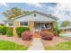 Charming brick home with blooming azaleas and well-maintained front yard landscaping at 1400 Russell Ave, Charlotte, NC 28216