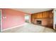 Inviting living room with wood paneling and a fireplace, offering a warm and comfortable space at 1400 Russell Ave, Charlotte, NC 28216